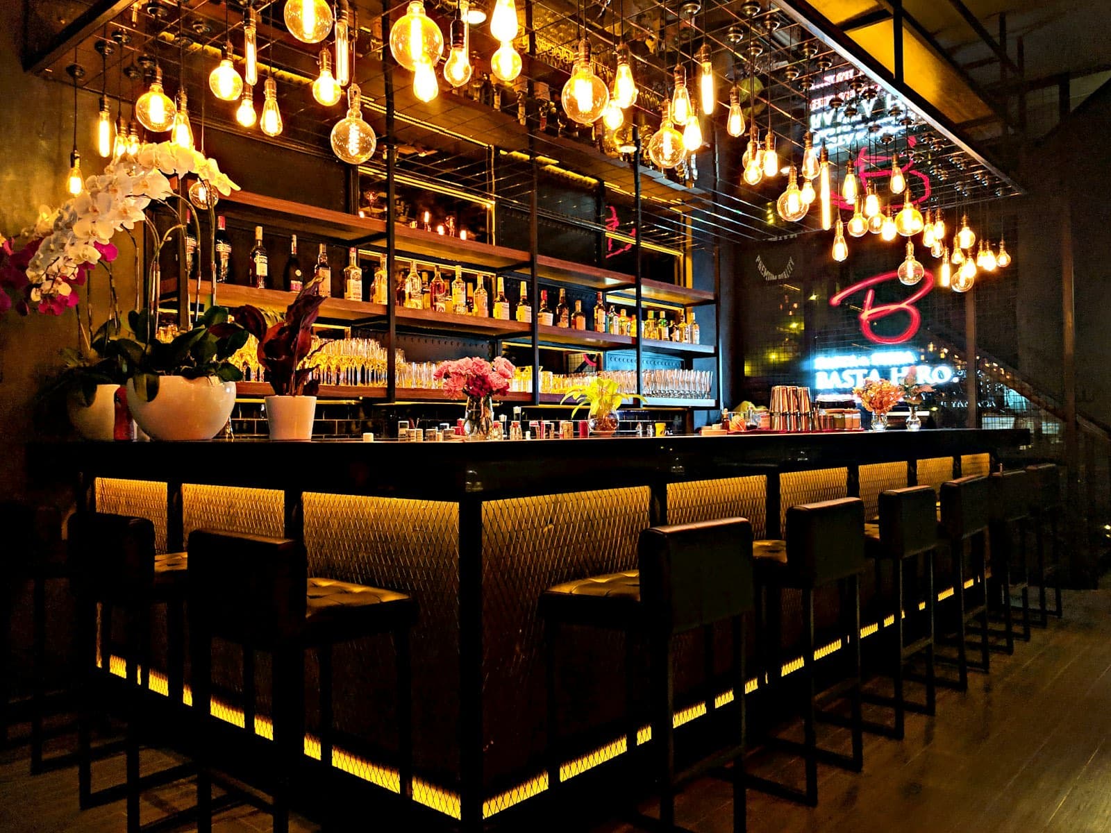Bar lit by hanging filament bulbs